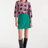 Women's playful pink blouse with bold strawberry pattern, round neckline and voluminous three-quarter sleeves for unique spring and summer fashion.