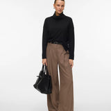 Women's timeless black roll-neck sweater with long sleeves and relaxed fit for an elevated capsule wardrobe.