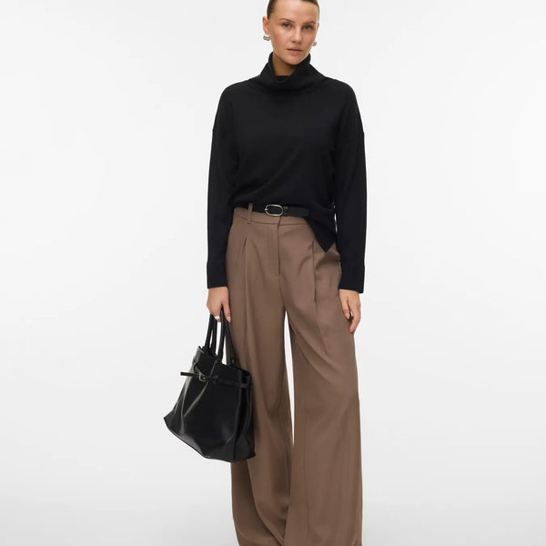 Women's timeless black roll-neck sweater with long sleeves and relaxed fit for an elevated capsule wardrobe.