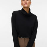 Women's minimalist black roll-neck sweater featuring a relaxed silhouette for versatile work, travel and everyday styling.