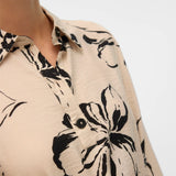 Women's cream floral midi dress featuring bold black botanical print, collared neckline and belted waist.