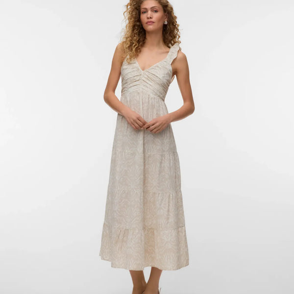 Women's ivory sleeveless midi dress featuring a textured botanical print, ruched bodice, ruffle shoulder straps, and flowing tiered skirt for timeless summer elegance.