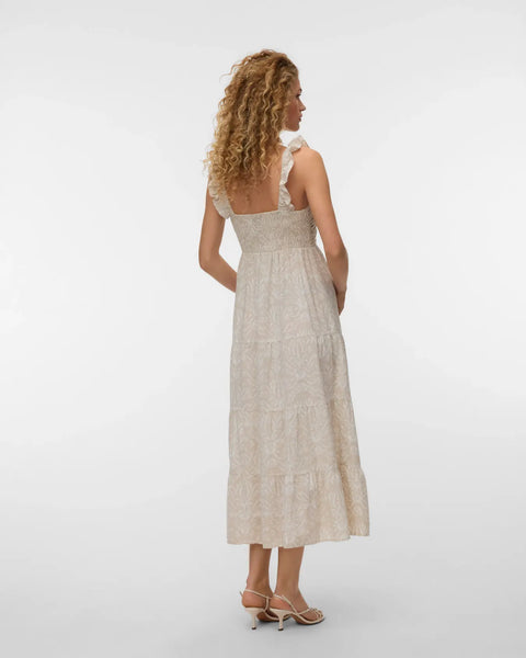 Women's lightweight cream dress with elegant botanical jacquard pattern, flowing midi length, and timeless resort-inspired styling.