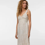 Women's bohemian-inspired midi dress crafted with an ivory botanical pattern, flowing tiered design, and romantic ruched bodice for elevated everyday style.