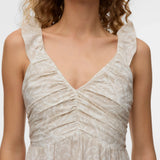 Elegant cream midi dress with soft jacquard floral texture, feminine gathered waist, and lightweight fabric perfect for weddings, vacations, and garden parties.
