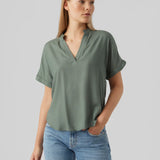 Women's sage green V-neck blouse with short rolled sleeves, relaxed fit and lightweight drape for effortless everyday and business casual style.