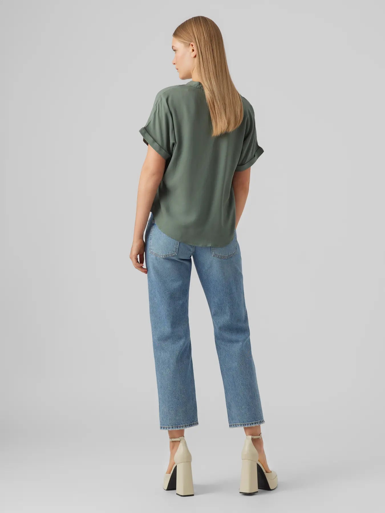 Women's relaxed fit green blouse featuring short cuffed sleeves, split neck design and soft draping fabric for versatile everyday wear.