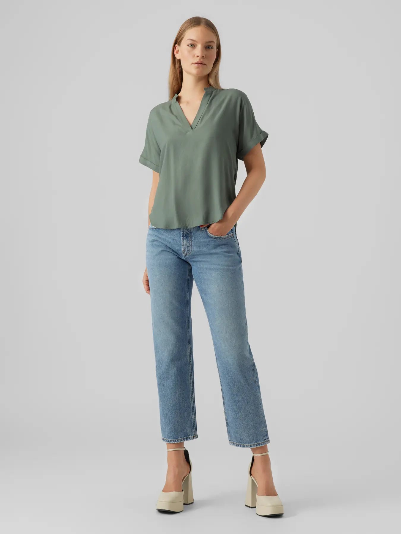 Boutique women's muted green V-neck blouse with rolled short sleeves and relaxed draped fit for sophisticated casual and office fashion.
