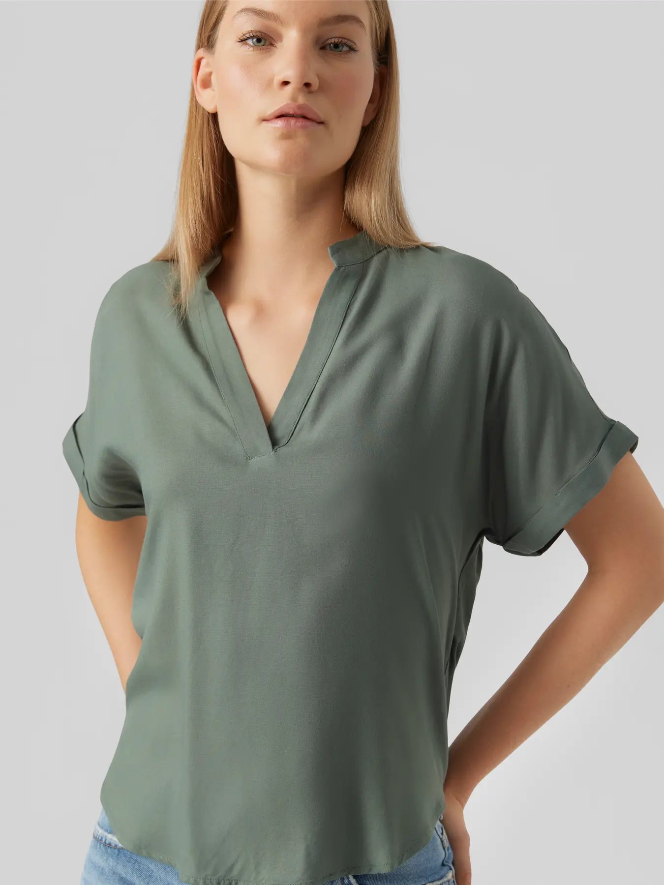 Boutique women's olive sage pullover blouse featuring a split neckline, cuffed sleeves and relaxed fit for business casual and travel outfits.