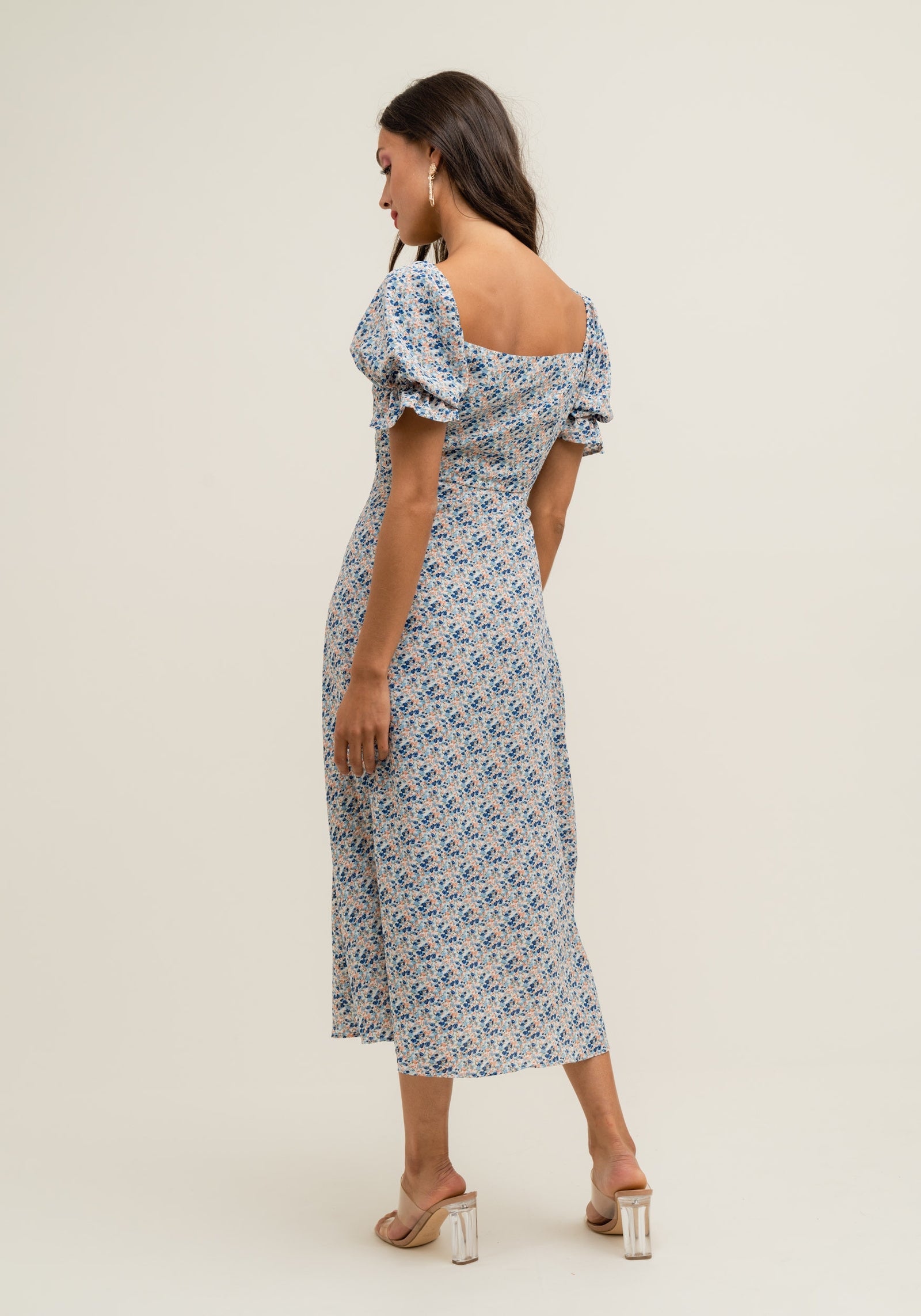 Women's vintage-inspired floral midi dress with timeless romantic detailing.