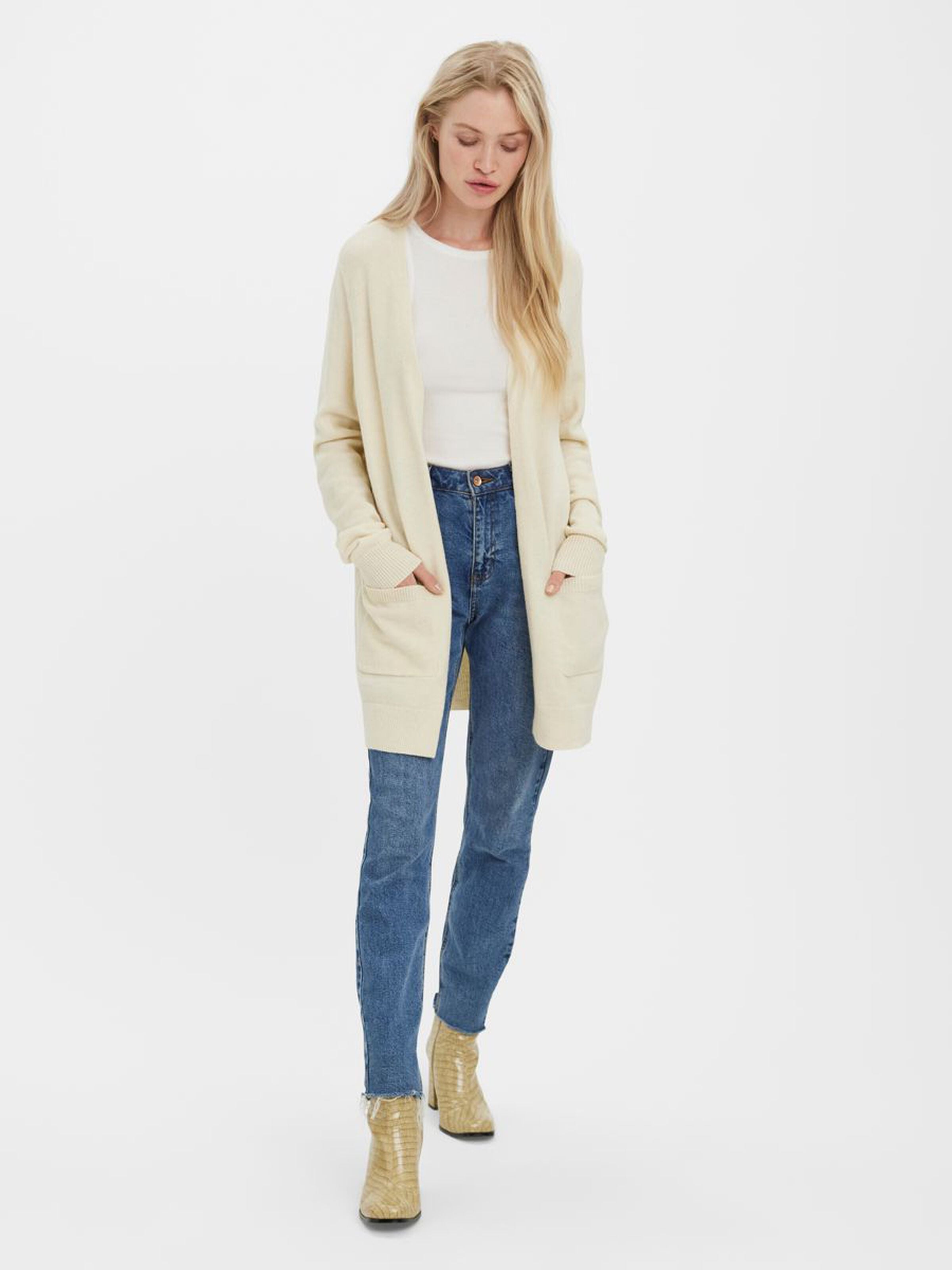 Soft ivory knit cardigan featuring a relaxed silhouette and practical pocket details.