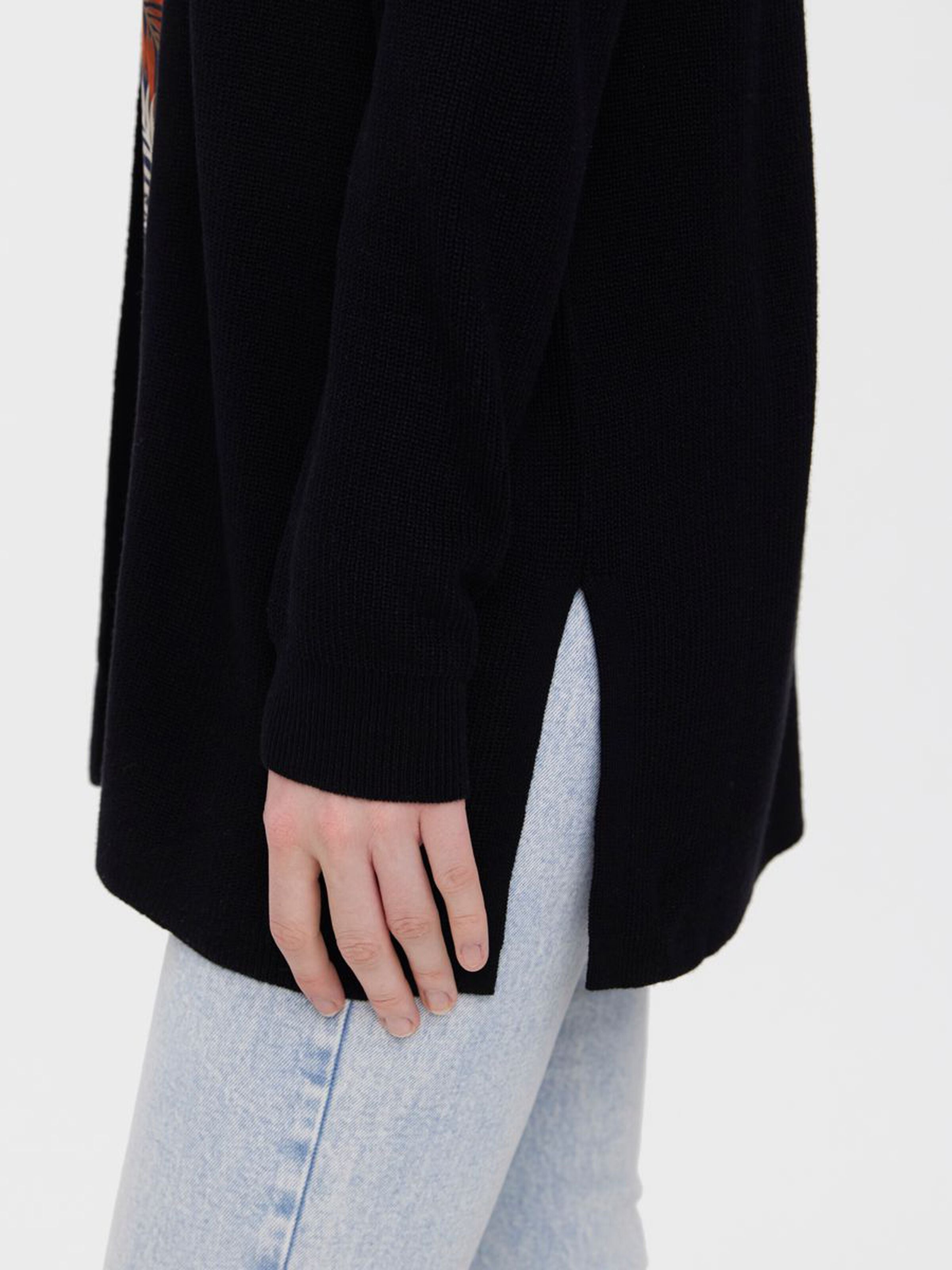 Women's lightweight layering cardigan offering timeless style and effortless versatility.
