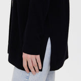 Women's lightweight layering cardigan offering timeless style and effortless versatility.