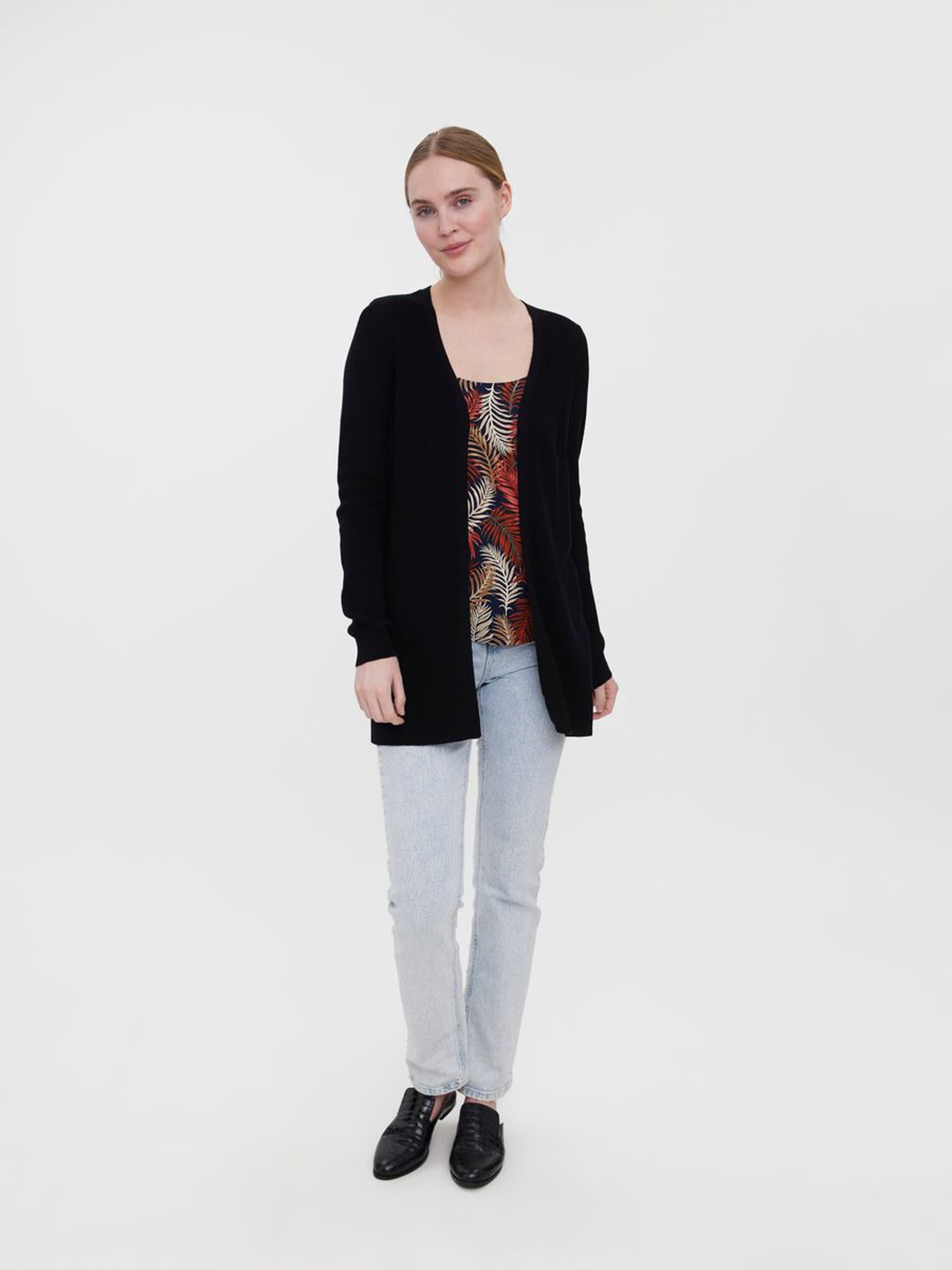 Soft black knit cardigan designed with a streamlined silhouette for modern everyday wear.
