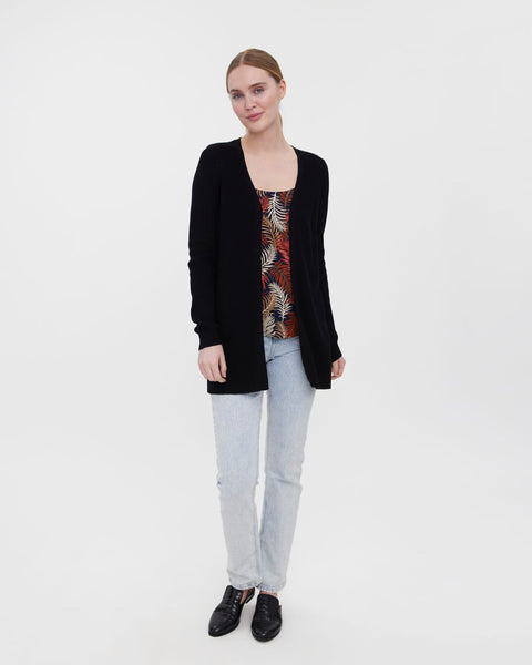 Soft black knit cardigan designed with a streamlined silhouette for modern everyday wear.