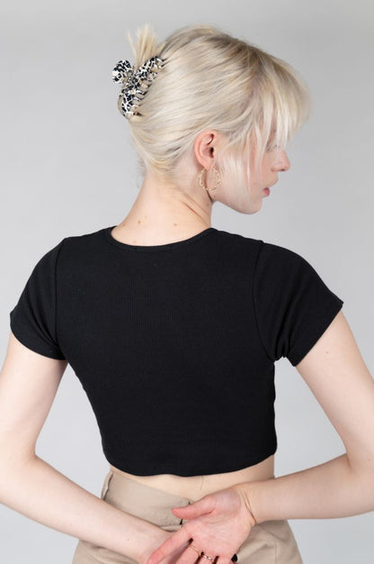 Black fitted crop tee perfect for casual outfits, nightlife looks, and street style.