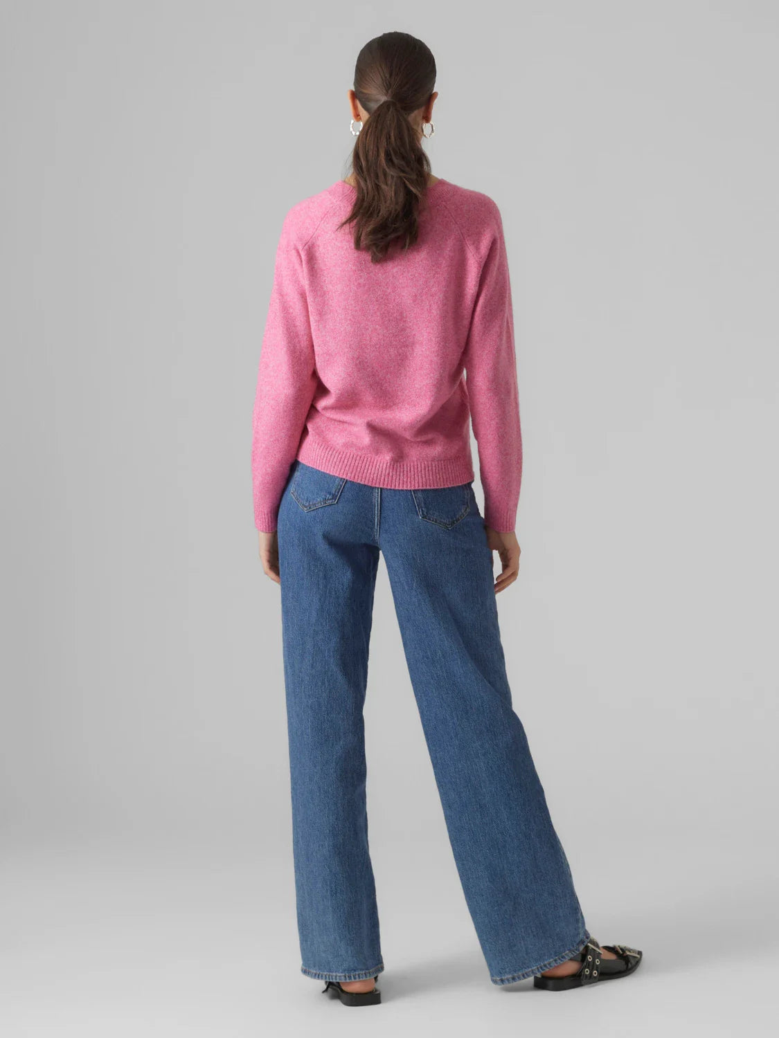 Women’s light pink crewneck sweater with relaxed fit and soft knit fabric for cozy everyday casual style.