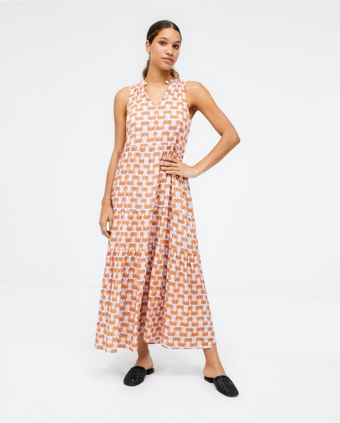 Women's bohemian floral dress with flowy fit and comfortable sleeveless design.