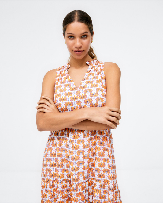 Women's summer vacation dress with orange floral pattern and breezy full-length design.