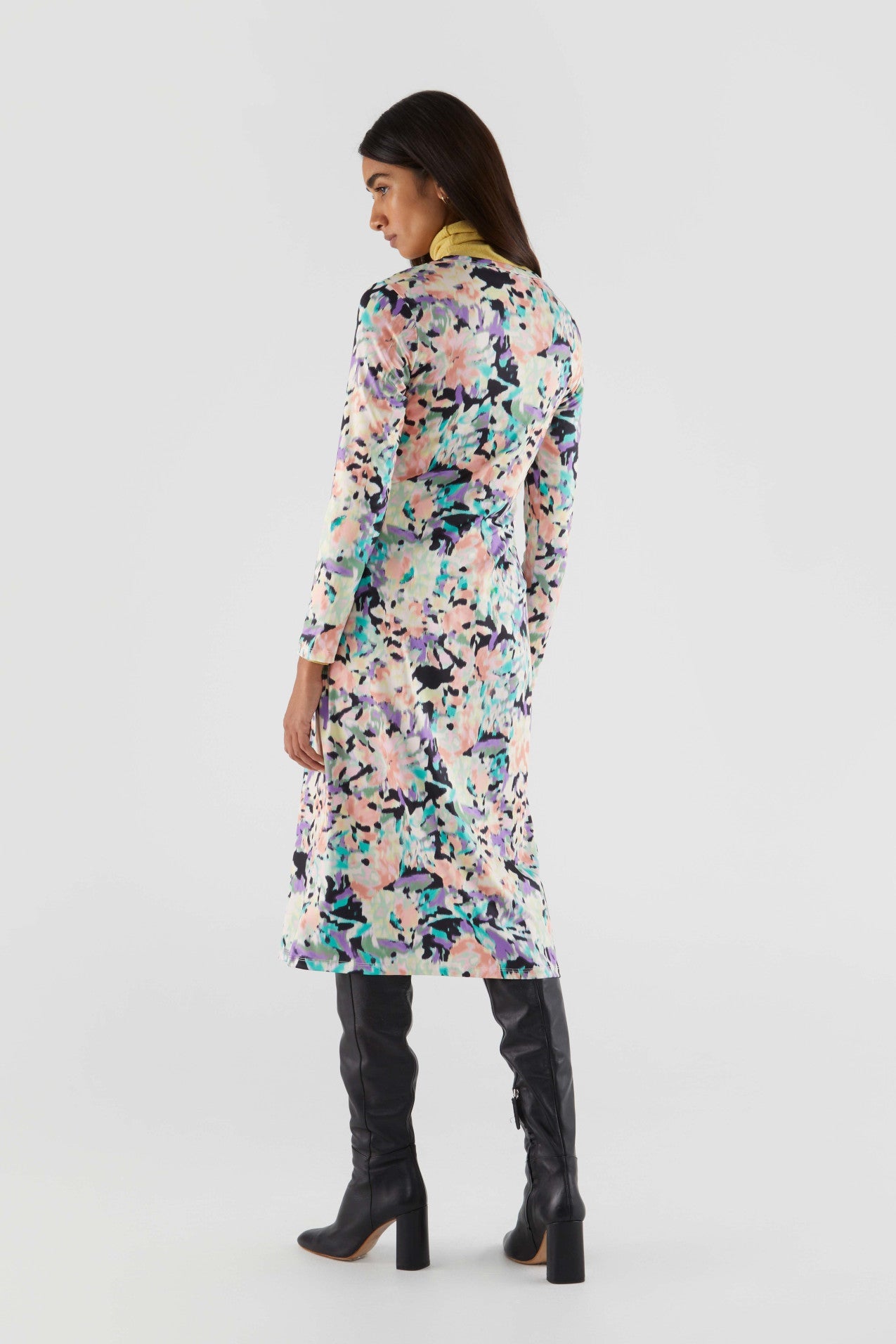 Fashion-forward floral bodycon midi dress with long sleeves and colorful painterly print for elevated everyday elegance.