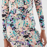 Detail of stylish women’s floral midi dress with pastel abstract print and flattering waist ruching for sophisticated casual looks.