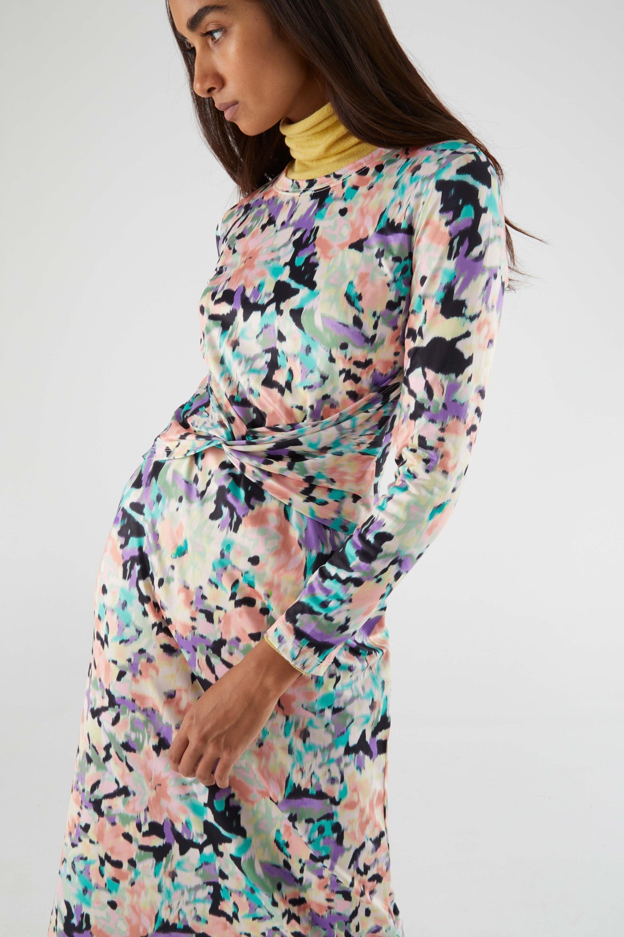 Chic multicolor floral dress with twist-front detail and midi length for trendy women’s fall and winter fashion looks.