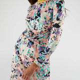 Chic multicolor floral dress with twist-front detail and midi length for trendy women’s fall and winter fashion looks.
