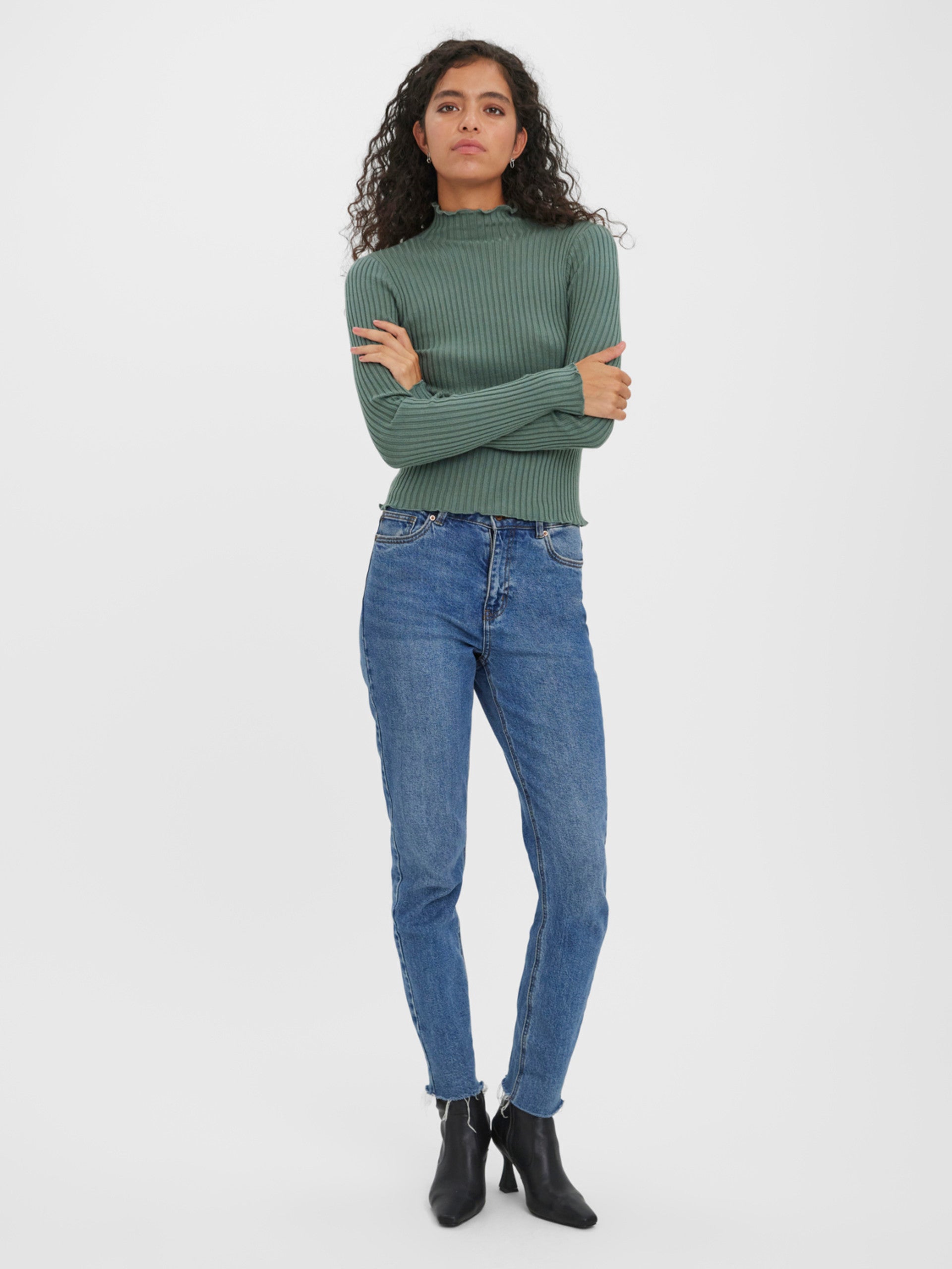 Women's stretch knit mock neck top with a flattering fitted silhouette and soft texture.