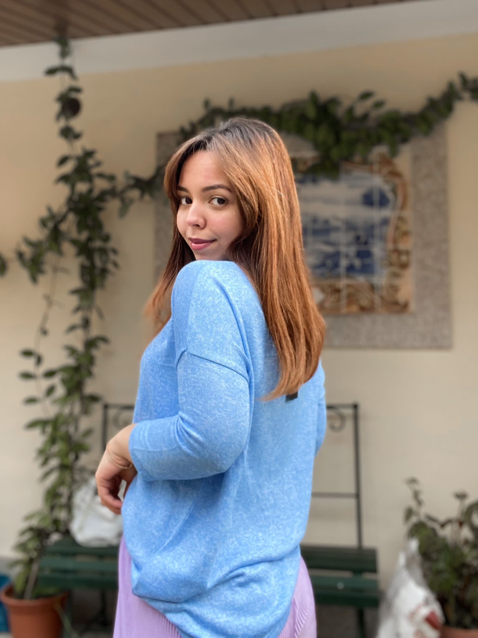 Soft blue crew neck sweater designed for layering and casual chic outfits.