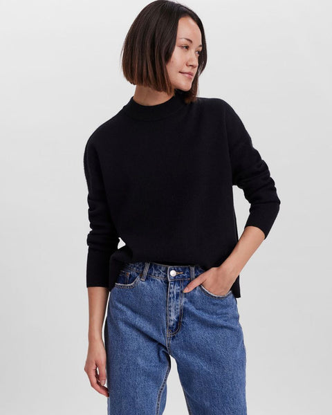 Cozy black sweater featuring a relaxed silhouette and wardrobe staple versatility.