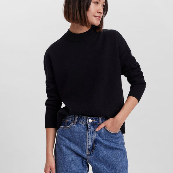 Cozy black sweater featuring a relaxed silhouette and wardrobe staple versatility.