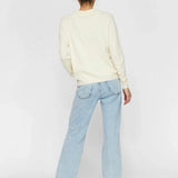 Women's off-white sweater with relaxed fit and versatile wardrobe essential appeal.