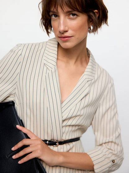 Stylish off-white pinstripe blazer with structured fit and effortless contemporary street-style fashion aesthetic.