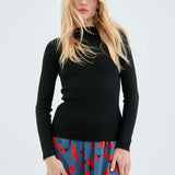 Soft black ribbed knit sweater with long sleeves and flattering slim silhouette for trendy capsule wardrobe styling.