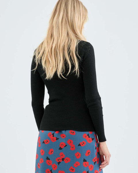 Elegant black long sleeve ribbed sweater for women with flattering tailored fit and timeless fashion versatility.
