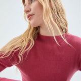 Classic pink coral ribbed pullover sweater featuring soft stretch knit fabric and timeless modern women’s styling.