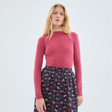 Women’s essential pink sweater with textured rib knit design and elegant fitted shape for polished casual looks.