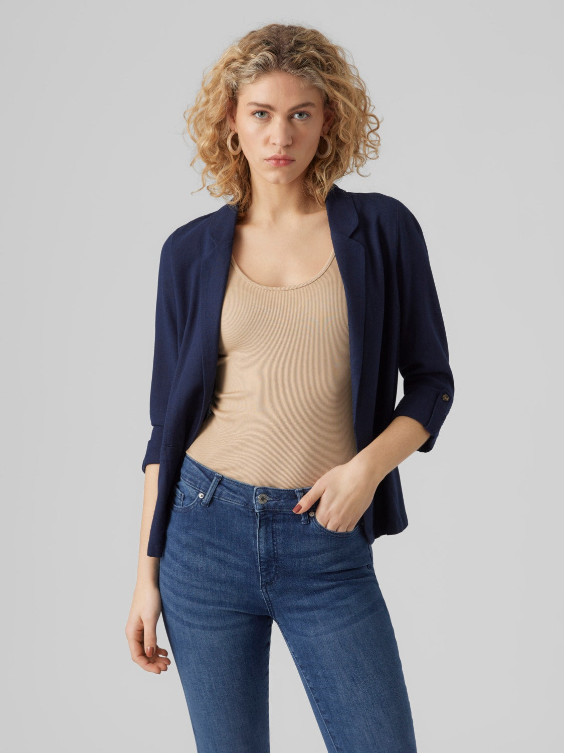Navy business casual blazer with relaxed structure and polished appearance.