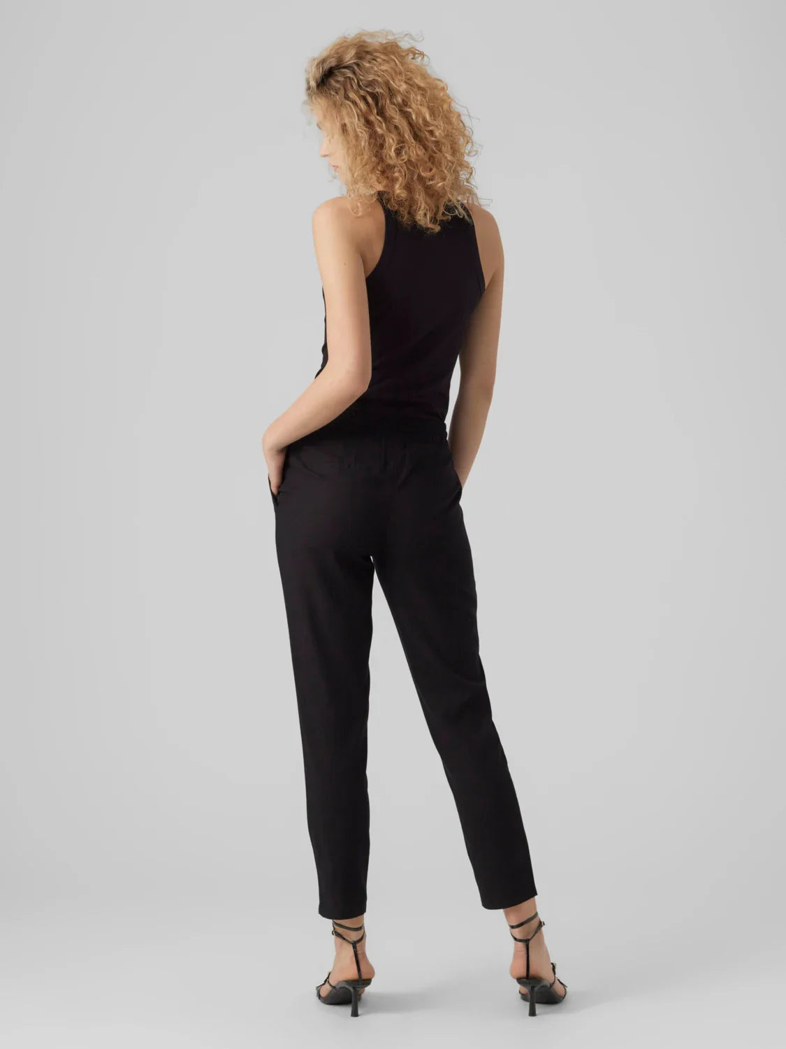 Women's tapered ankle pants with adjustable drawstring waistband and streamlined silhouette.