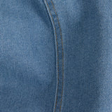 Material detail of modern denim sheath dress with minimalist design and elevated casual luxe appeal.