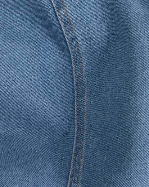 Material detail of modern denim sheath dress with minimalist design and elevated casual luxe appeal.