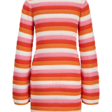 Trend-driven fitted stripe dress with artisanal crochet texture and elevated boho-chic vibe.