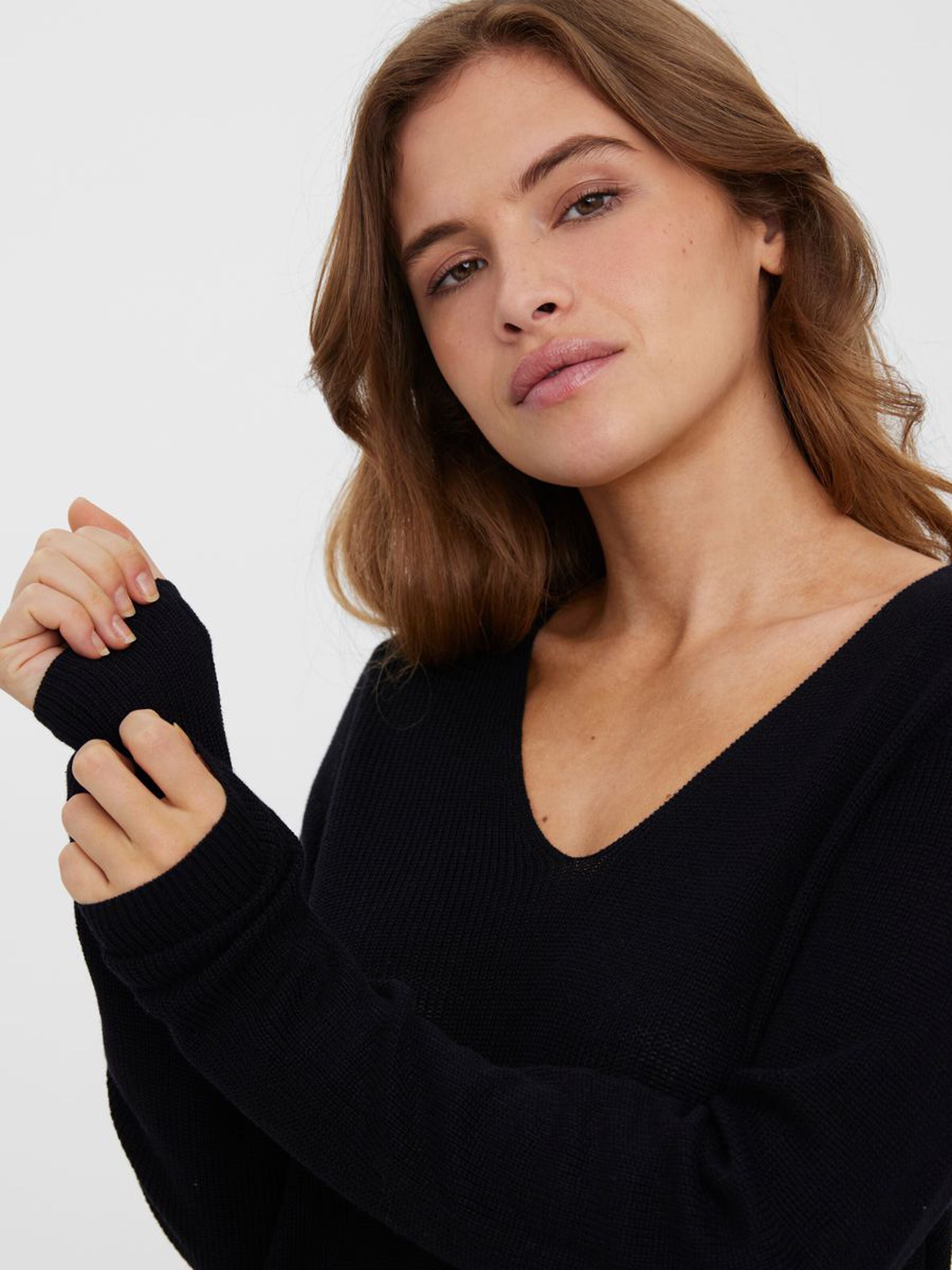 Women's soft knit V-neck sweater featuring a feminine silhouette and lightweight construction.