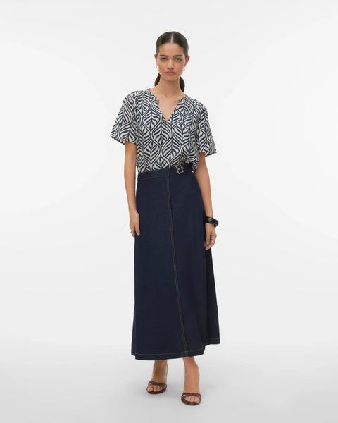Women's boutique leaf print top with short sleeves, flattering drape, and breathable fabric perfect for warm-weather dressing.