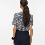 Women's navy leaf pattern blouse offering timeless sophistication, breathable comfort, and minimalist boutique fashion.