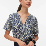 Women's navy and ivory botanical print blouse featuring a split V-neckline, relaxed fit, and lightweight short sleeves for effortless everyday style.