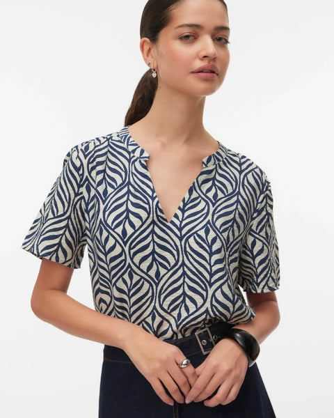 Women's navy and ivory botanical print blouse featuring a split V-neckline, relaxed fit, and lightweight short sleeves for effortless everyday style.
