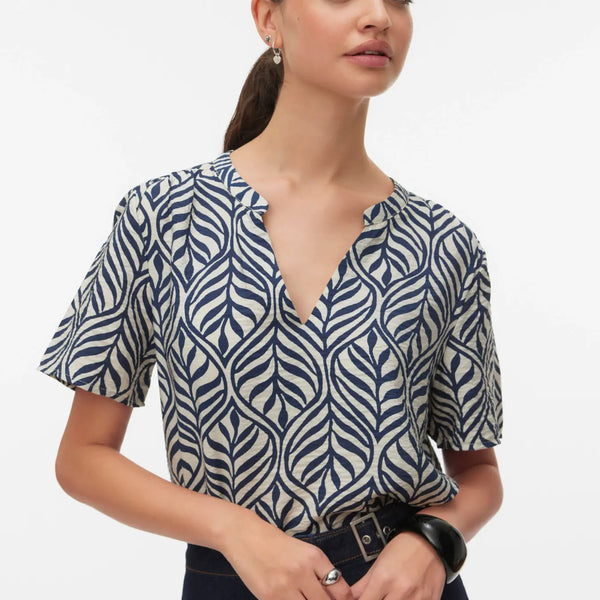 Women's navy and ivory botanical print blouse featuring a split V-neckline, relaxed fit, and lightweight short sleeves for effortless everyday style.