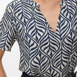 Women's casual botanical print blouse perfect for capsule wardrobes, travel outfits, smart casual looks, and effortless layering.