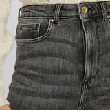 Dark gray slim fit jeans for women featuring a flattering high-waisted silhouette.
